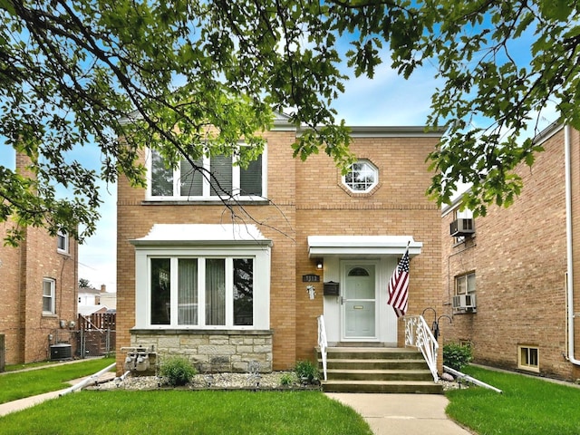 7513 W Isham Ave, Chicago, IL 60631 - view of front of property featuring a front lawn, brick siding, and cooling unit