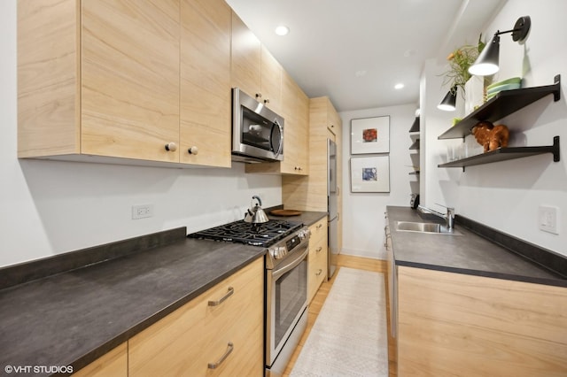 734 Noyes St Unit L1, Evanston, IL 60201 - kitchen featuring appliances with stainless steel finishes, light brown cabinets, open shelves, a sink, and recessed lighting