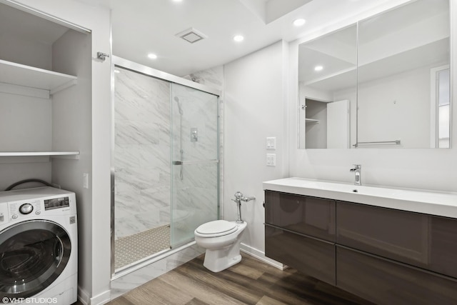 300 N State St Unit 4930, Chicago, IL 60654 - full bathroom with washer / dryer, wood finished floors, a shower stall, vanity, and recessed lighting