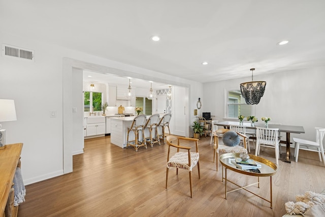 114 Washington St, Bloomingdale, IL 60108 - living room featuring light wood-type flooring, a chandelier, recessed lighting, and baseboards