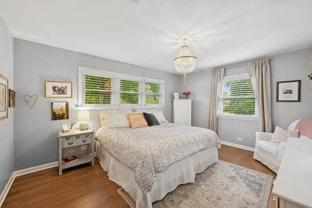 114 Washington St, Bloomingdale, IL 60108 - bedroom with multiple windows, baseboards, and wood finished floors