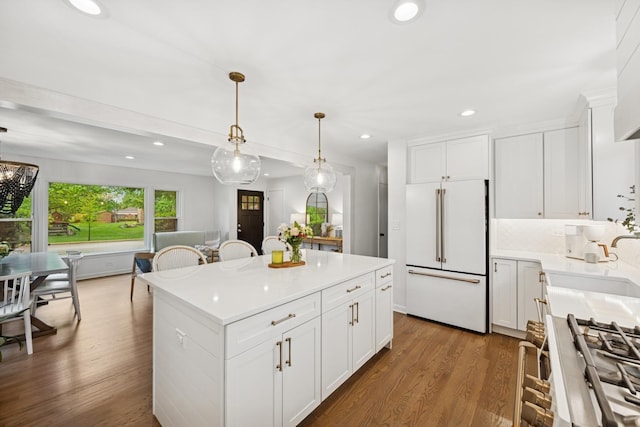 114 Washington St, Bloomingdale, IL 60108 - kitchen featuring high end white refrigerator, recessed lighting, dark wood-type flooring, a center island, and pendant lighting