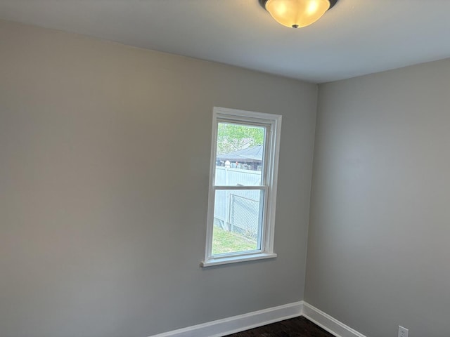 926 Park Ave, Winthrop Harbor, IL 60096 - unfurnished room with baseboards and dark wood-style flooring