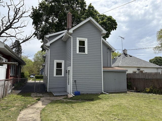 926 Park Ave, Winthrop Harbor, IL 60096 - rear view of house with a chimney
