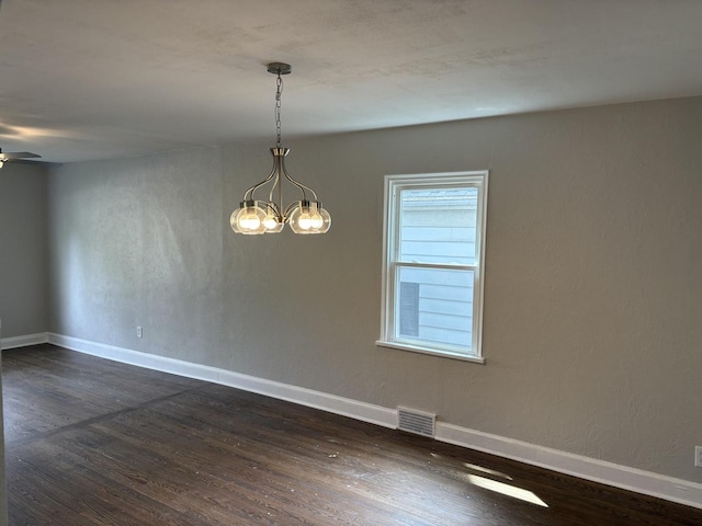 926 Park Ave, Winthrop Harbor, IL 60096 - spare room with dark wood-style flooring, a chandelier, a ceiling fan, and baseboards