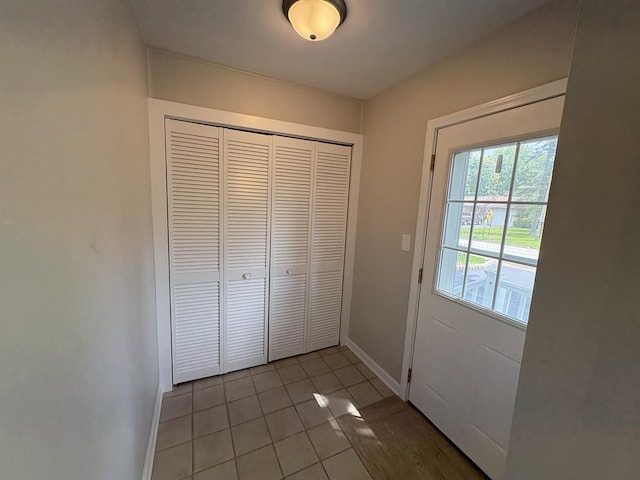 926 Park Ave, Winthrop Harbor, IL 60096 - doorway with baseboards and light tile patterned floors
