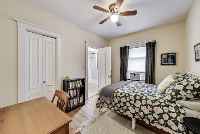 5143 S Greenwood Ave Unit 1, Chicago, IL 60615 - bedroom featuring wood finished floors, cooling unit, a ceiling fan, and connected bathroom