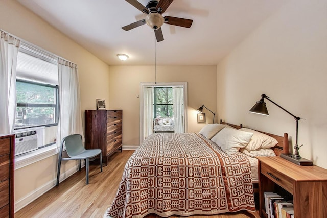 5143 S Greenwood Ave Unit 1, Chicago, IL 60615 - bedroom with light wood finished floors, ceiling fan, and cooling unit