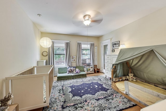 5143 S Greenwood Ave Unit 1, Chicago, IL 60615 - bedroom featuring wood finished floors, cooling unit, and ceiling fan