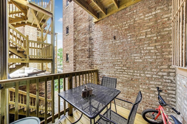 5143 S Greenwood Ave Unit 1, Chicago, IL 60615 - view of wooden balcony featuring stairway, outdoor dining space, and a deck