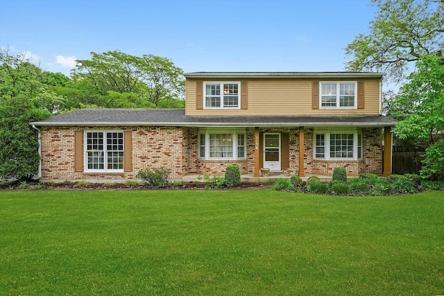 1136 S Naper Blvd, Naperville, IL 60540 - traditional-style house with a front yard, brick siding, and covered porch