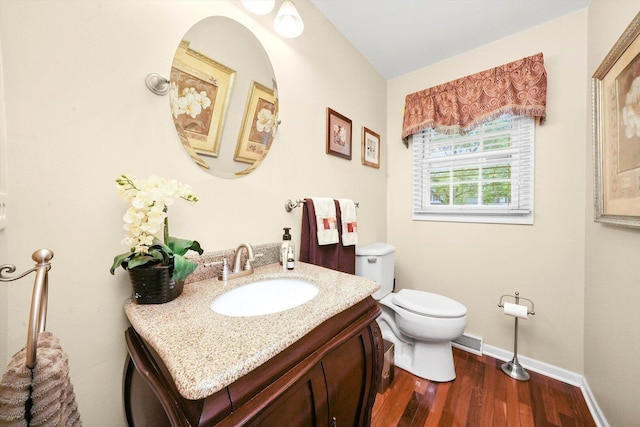 1136 S Naper Blvd, Naperville, IL 60540 - half bath with toilet, vanity, wood finished floors, and baseboards
