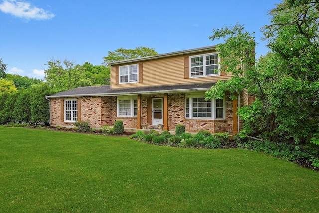 1136 S Naper Blvd, Naperville, IL 60540 - traditional-style house featuring a front yard, brick siding, and covered porch