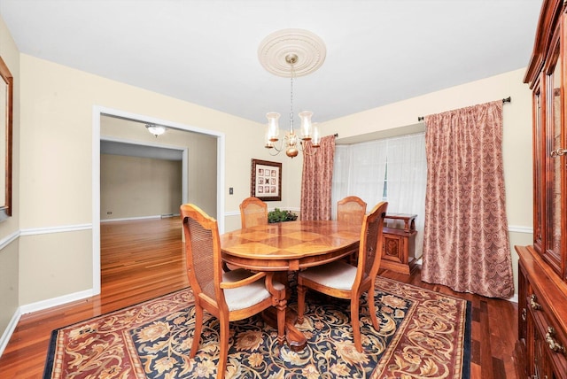 1136 S Naper Blvd, Naperville, IL 60540 - dining room featuring a chandelier, wood finished floors, and baseboards