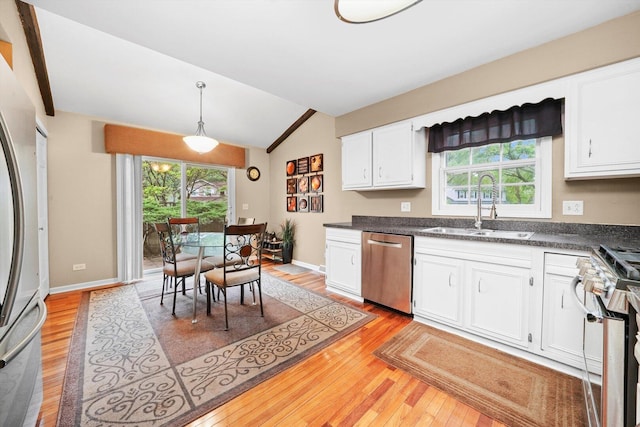 1136 S Naper Blvd, Naperville, IL 60540 - kitchen with appliances with stainless steel finishes, a sink, light wood finished floors, lofted ceiling, and white cabinets