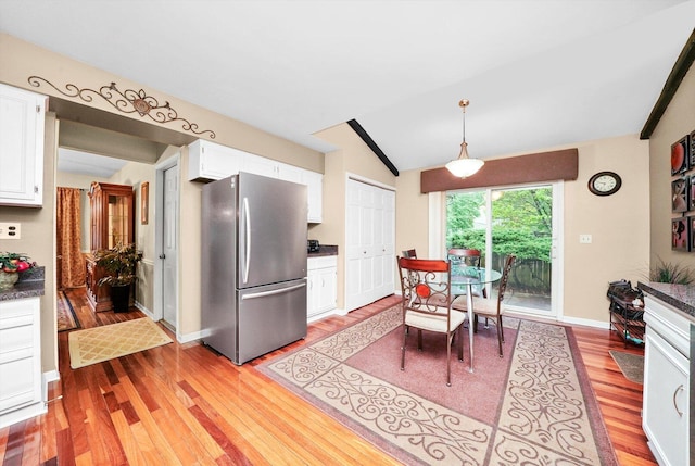 1136 S Naper Blvd, Naperville, IL 60540 - dining room with lofted ceiling, light wood-style flooring, and baseboards