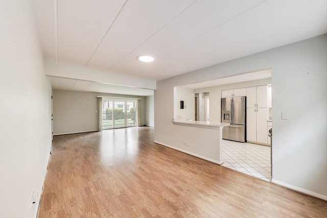 6478 N NW Hwy Unit 1, Chicago, IL 60631 - unfurnished living room with light wood-type flooring and baseboards