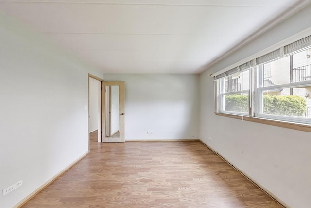 6478 N NW Hwy Unit 1, Chicago, IL 60631 - unfurnished room featuring light wood-style floors and baseboards