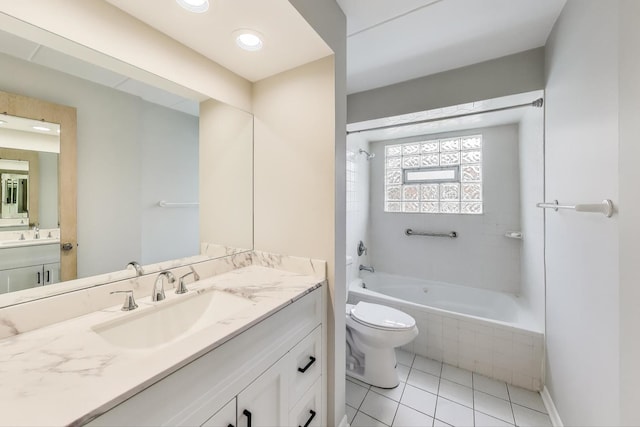 6478 N NW Hwy Unit 1, Chicago, IL 60631 - bathroom with toilet, vanity, tile patterned floors, and tiled shower / bath combo