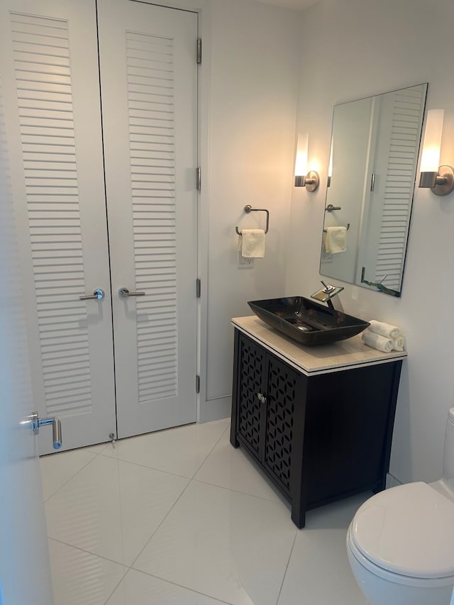 401 N Wabash Ave Unit 51C, Chicago, IL 60611 - bathroom with a closet, vanity, toilet, and tile patterned floors