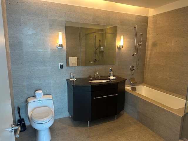401 N Wabash Ave Unit 51C, Chicago, IL 60611 - bathroom with tile walls, vanity, toilet, tiled shower / bath combo, and tile patterned floors