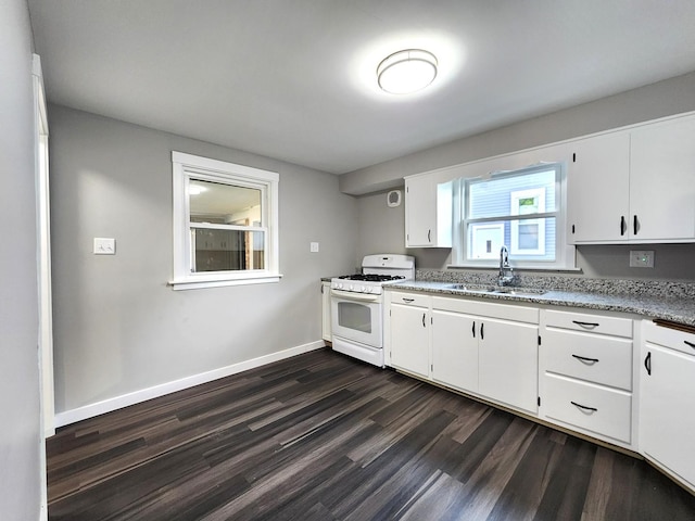673 Slade Ave, Elgin, IL 60120 - kitchen with white range with gas stovetop, a sink, dark wood-type flooring, white cabinets, and light stone countertops
