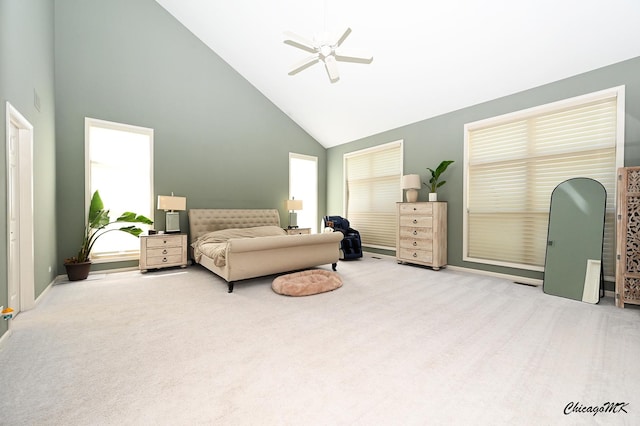 328 Erie Cir, Bloomingdale, IL 60108 - carpeted bedroom with high vaulted ceiling, multiple windows, ceiling fan, and baseboards