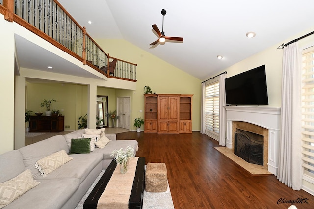 328 Erie Cir, Bloomingdale, IL 60108 - living room featuring ceiling fan, high vaulted ceiling, a tile fireplace, wood finished floors, and plenty of natural light