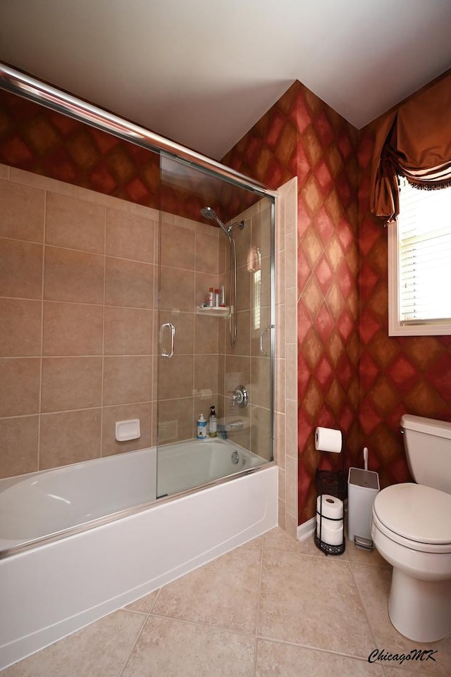 328 Erie Cir, Bloomingdale, IL 60108 - bathroom with tile patterned flooring, shower / bath combination with glass door, toilet, and tile walls