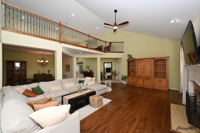 328 Erie Cir, Bloomingdale, IL 60108 - living room featuring a chandelier, dark wood-style flooring, a ceiling fan, high vaulted ceiling, and recessed lighting