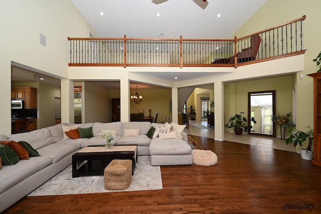 328 Erie Cir, Bloomingdale, IL 60108 - living room featuring high vaulted ceiling, ceiling fan, wood finished floors, a chandelier, and recessed lighting