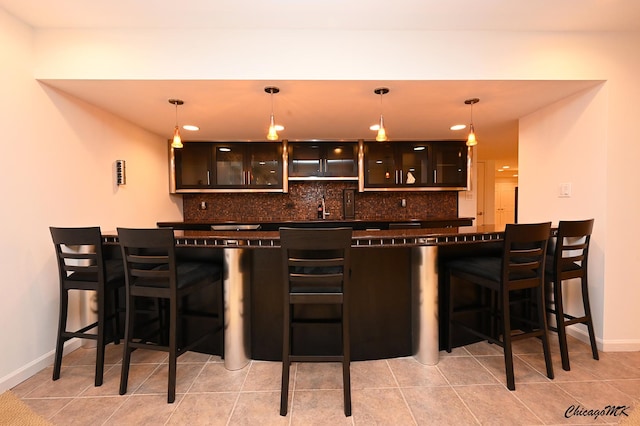 328 Erie Cir, Bloomingdale, IL 60108 - indoor wet bar with backsplash, baseboards, decorative light fixtures, recessed lighting, and light tile patterned floors