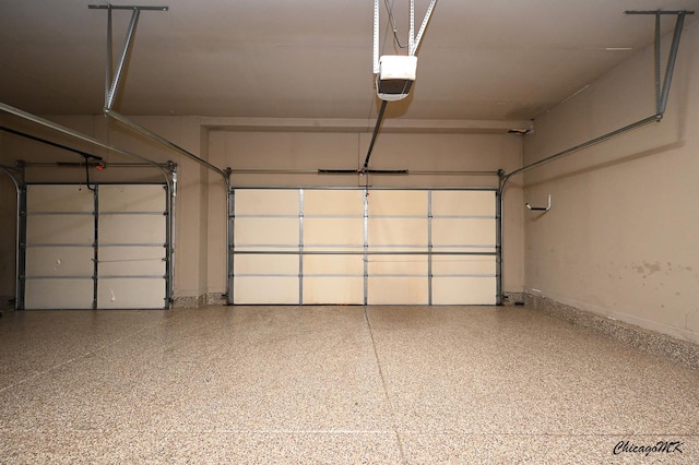 328 Erie Cir, Bloomingdale, IL 60108 - garage featuring a garage door opener and baseboards