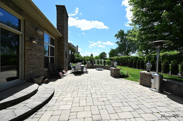 328 Erie Cir, Bloomingdale, IL 60108 - fenced backyard with outdoor dining area and a patio area