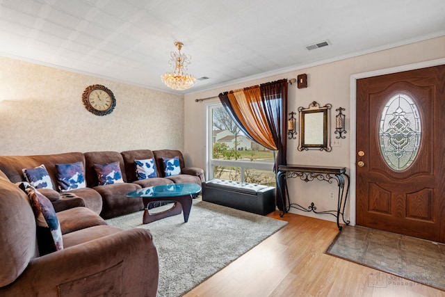 125 Seton Pl, Streamwood, IL 60107 - living area featuring crown molding, light wood-style floors, and a chandelier