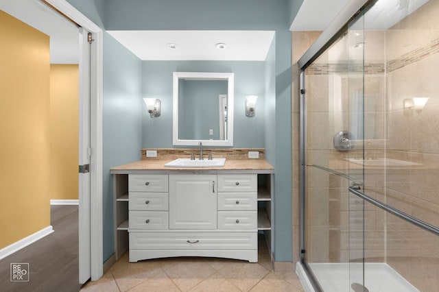 820 N Dexter Ln, Hoffman Estates, IL 60169 - bathroom with vanity, a stall shower, baseboards, and tile patterned floors