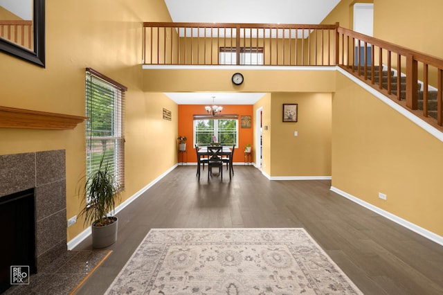 820 N Dexter Ln, Hoffman Estates, IL 60169 - entrance foyer with wood finished floors, a chandelier, baseboards, and a high ceiling