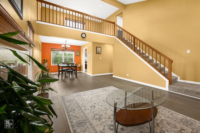 820 N Dexter Ln, Hoffman Estates, IL 60169 - living area with stairs, wood finished floors, a chandelier, baseboards, and a towering ceiling