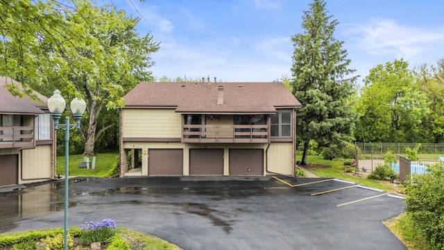 5 Cobblestone Ct Unit C, Palos Hills, IL 60465 - back of property with roof with shingles and a balcony