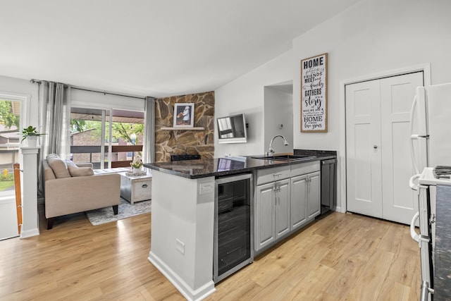 5 Cobblestone Ct Unit C, Palos Hills, IL 60465 - kitchen featuring beverage cooler, a peninsula, a sink, range, and dishwasher