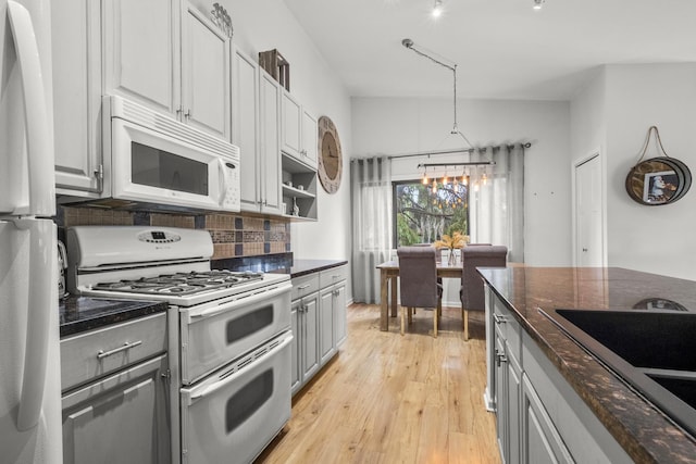 5 Cobblestone Ct Unit C, Palos Hills, IL 60465 - kitchen featuring white appliances, gray cabinets, a chandelier, light wood-type flooring, and decorative backsplash