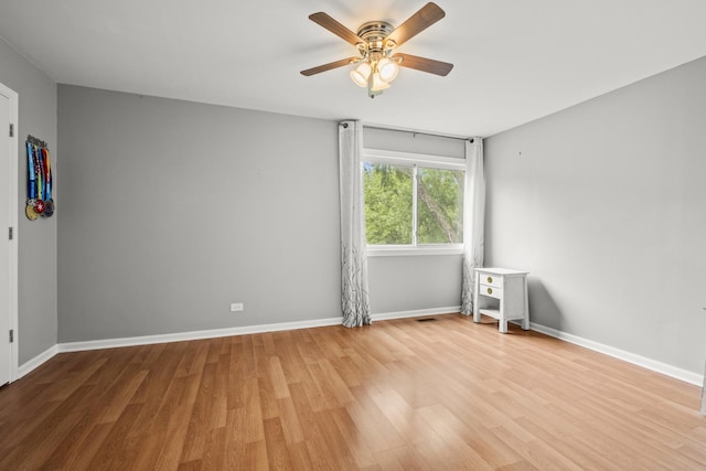 5 Cobblestone Ct Unit C, Palos Hills, IL 60465 - unfurnished room with light wood-style floors, ceiling fan, and baseboards
