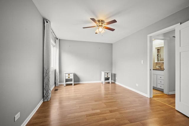 5 Cobblestone Ct Unit C, Palos Hills, IL 60465 - unfurnished living room featuring a ceiling fan, light wood finished floors, and baseboards