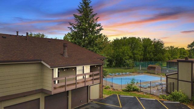 5 Cobblestone Ct Unit C, Palos Hills, IL 60465 - pool at dusk featuring a community pool and a patio area