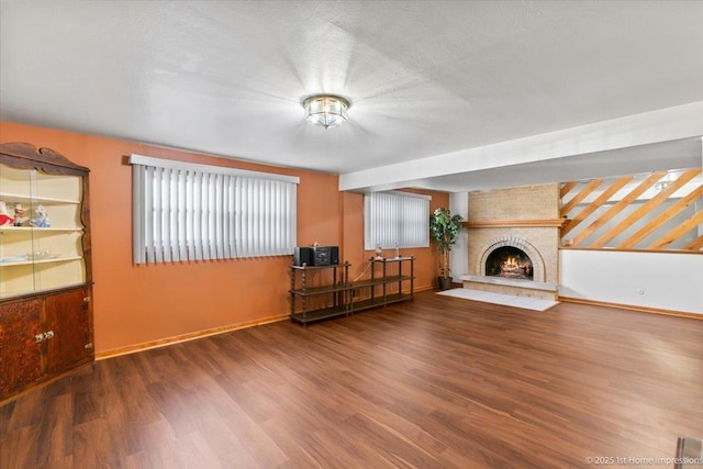 15435 Orogrande Dr, Oak Forest, IL 60452 - unfurnished living room featuring wood finished floors, baseboards, and a fireplace