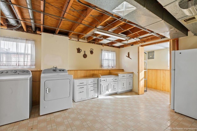 15435 Orogrande Dr, Oak Forest, IL 60452 - washroom with washing machine and dryer, wainscoting, wooden walls, light floors, and cabinet space
