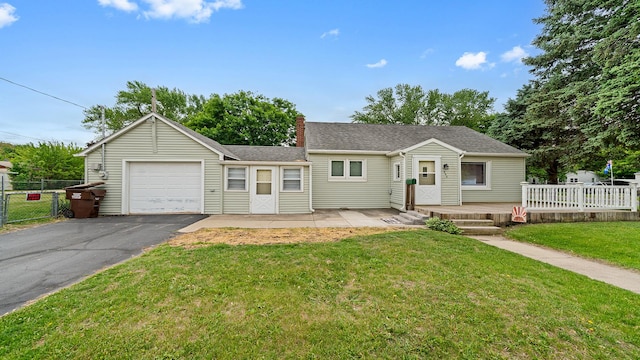 450 Gayton Ave, South Beloit, IL 61080 - view of front facade featuring an attached garage, driveway, and a chimney
