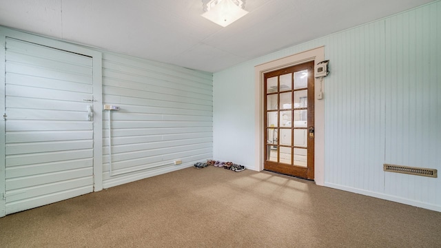 450 Gayton Ave, South Beloit, IL 61080 - carpeted spare room with wooden walls and baseboards
