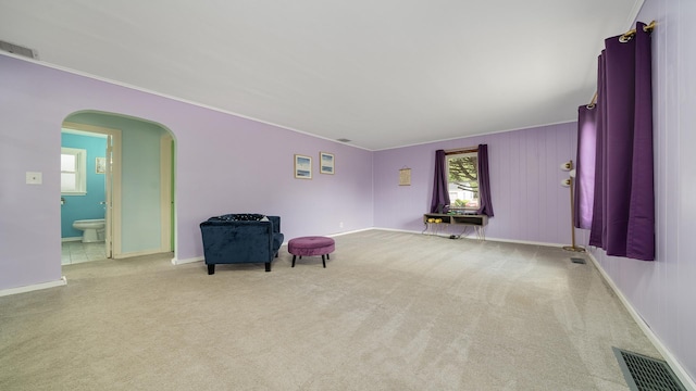 450 Gayton Ave, South Beloit, IL 61080 - living area with arched walkways, carpet, crown molding, and baseboards