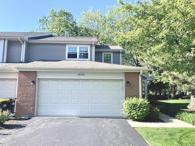 1422 W Orchard Pl Unit B, Arlington Heights, IL 60005 - view of front of house with brick siding and asphalt driveway